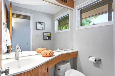 Example of a small trendy single-sink bathroom design in Richmond with gray walls, white countertops and a built-in vanity