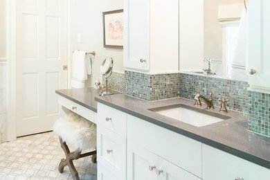 Bathroom - mid-sized transitional gray tile and marble tile marble floor and gray floor bathroom idea in Little Rock with shaker cabinets, white cabinets, a two-piece toilet, gray walls, an undermount sink, quartz countertops, a hinged shower door and gray countertops