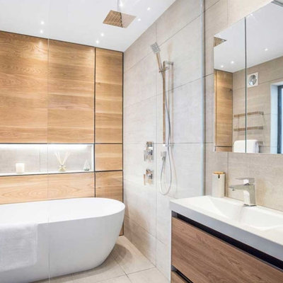 Inspiration for a mid-sized scandinavian kids' brown tile and wood-look tile ceramic tile, gray floor and single-sink bathroom remodel in London with flat-panel cabinets, light wood cabinets, a one-piece toilet, gray walls, a console sink, solid surface countertops, white countertops and a freestanding vanity