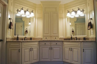 This is an example of a large classic ensuite bathroom in Atlanta with beaded cabinets, beige cabinets, beige walls, a submerged sink, granite worktops and multi-coloured worktops.