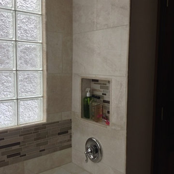 Recessed niche glass block window and bench seat in handicapped shower Columbus