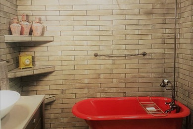 Inspiration for a beige tile and ceramic tile ceramic tile bathroom remodel in Other with a vessel sink