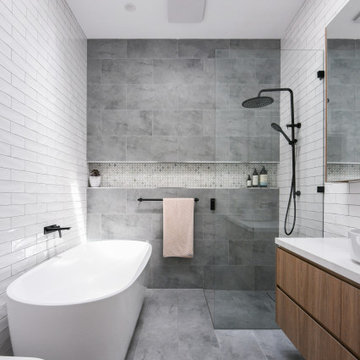 Modern bathroom with tiled shower niche
