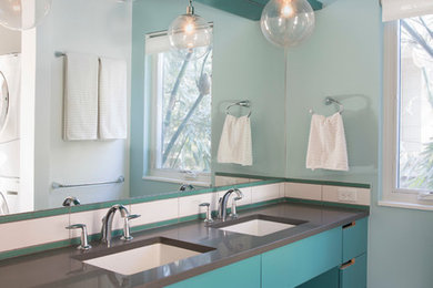 Bathroom - contemporary bathroom idea in Austin with flat-panel cabinets, blue cabinets and gray countertops
