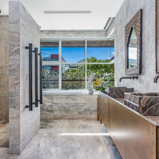 Design ideas for an asian master bathroom in Perth with a curbless shower, beige tile, gray tile, grey walls, a vessel sink, beige floor, an open shower and brown benchtops.