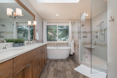 Photo of a traditional ensuite bathroom in Portland with a freestanding bath, a walk-in shower, a one-piece toilet, grey walls and ceramic flooring.