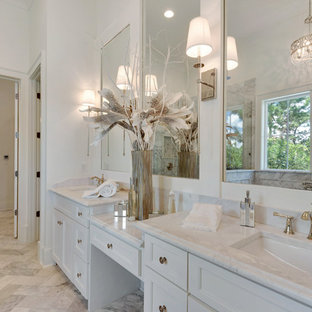 Inspiration for a large coastal master gray tile, white tile and stone slab marble floor bathroom remodel in Miami with recessed-panel cabinets, white cabinets, white walls, an undermount sink and marble countertops