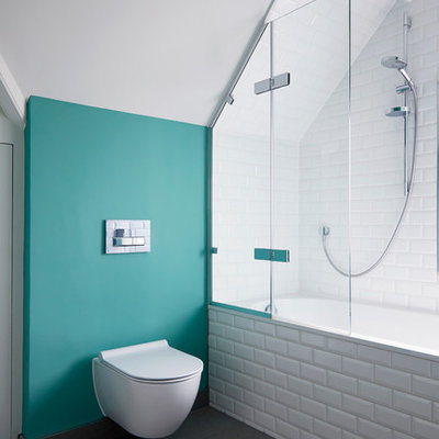 Inspiration for a transitional white tile and subway tile gray floor bathroom remodel in Surrey with a wall-mount toilet and green walls
