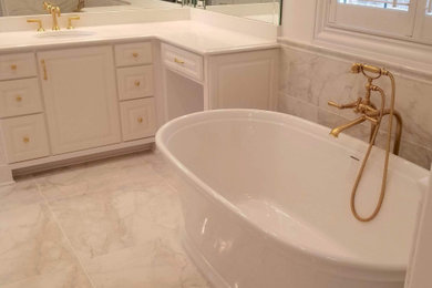 Inspiration for a large modern master multicolored tile and ceramic tile ceramic tile, white floor and double-sink bathroom remodel in Nashville with raised-panel cabinets, white cabinets, a one-piece toilet, white walls, a drop-in sink, quartzite countertops, a hinged shower door, white countertops and a built-in vanity