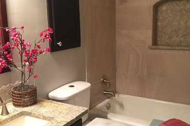 Example of a mid-sized transitional 3/4 beige tile and porcelain tile ceramic tile bathroom design in Albuquerque with shaker cabinets, dark wood cabinets, a two-piece toilet, beige walls, an undermount sink and granite countertops