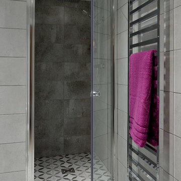 Remodelled  en suite bathroom using concrete effect tiles