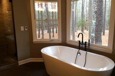 Bathroom - mid-sized modern master dark wood floor and brown floor bathroom idea in Raleigh with brown walls