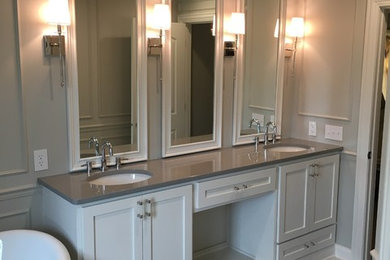 Mid-sized transitional master marble floor and gray floor freestanding bathtub photo in Omaha with shaker cabinets, white cabinets, gray walls, an undermount sink and quartzite countertops