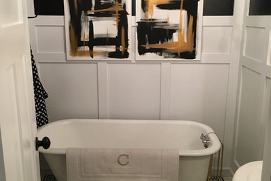 Mid-sized transitional marble floor and gray floor claw-foot bathtub photo in Omaha with white cabinets, a two-piece toilet, gray walls, a pedestal sink and a hinged shower door