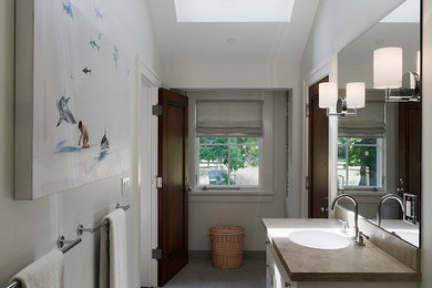 Example of a classic master gray tile limestone floor bathroom design in San Francisco with an undermount sink, flat-panel cabinets and white cabinets