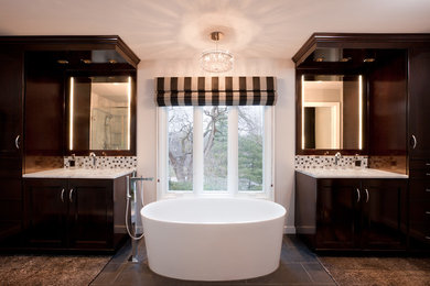 Design ideas for a large traditional ensuite bathroom in Houston with a submerged sink, raised-panel cabinets, dark wood cabinets, marble worktops, a freestanding bath, a corner shower, white tiles, glass tiles, white walls, porcelain flooring, brown floors and a hinged door.