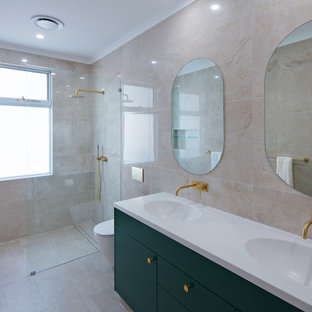 Design ideas for a contemporary bathroom in Sydney with flat-panel cabinets, green cabinets, a curbless shower, beige tile, an integrated sink, beige floor, an open shower, white benchtops, a double vanity and a floating vanity.