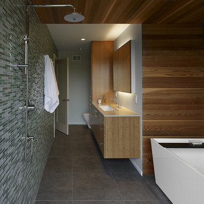 Mid-sized minimalist master mosaic tile gray floor bathroom photo in San Francisco with a one-piece toilet, gray walls, an undermount sink, flat-panel cabinets, light wood cabinets, quartz countertops and white countertops