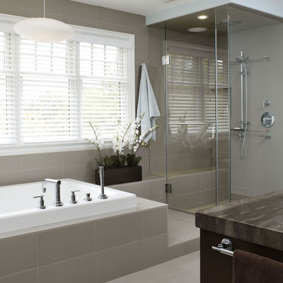 Inspiration for a mid-sized contemporary gray tile and porcelain tile slate floor drop-in bathtub remodel in Toronto with dark wood cabinets, marble countertops and gray walls