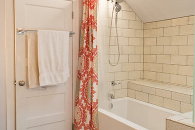 Bathroom - small eclectic master white tile and ceramic tile ceramic tile and multicolored floor bathroom idea in Portland with recessed-panel cabinets, white cabinets, a two-piece toilet, white walls, a drop-in sink and quartz countertops
