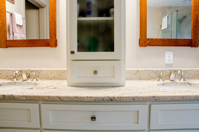 Mid-sized mountain style master beige tile and ceramic tile ceramic tile bathroom photo in Richmond with white cabinets, a two-piece toilet, beige walls, granite countertops, shaker cabinets and an undermount sink