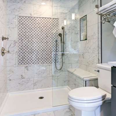 Example of a small trendy 3/4 white tile and marble tile marble floor and white floor alcove shower design in Other with shaker cabinets, gray cabinets, a two-piece toilet, white walls, an undermount sink, quartzite countertops, a hinged shower door and white countertops