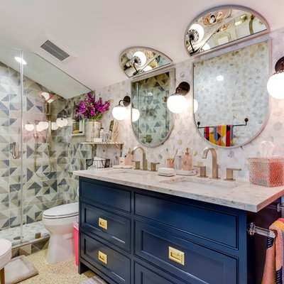 Alcove shower - eclectic kids' multicolored tile alcove shower idea in Austin with furniture-like cabinets, blue cabinets, multicolored walls, an undermount sink, a hinged shower door and multicolored countertops