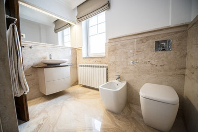 Bathroom - traditional master marble floor and beige floor bathroom idea in Other