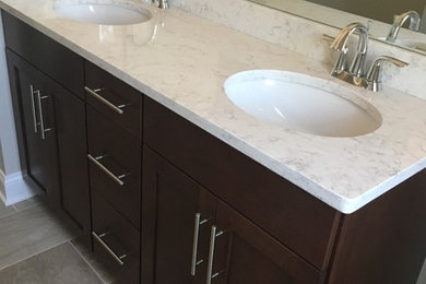 Bathroom - traditional bathroom idea in New York with shaker cabinets and quartz countertops