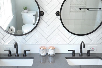 Example of a mid-sized urban master white tile and porcelain tile ceramic tile and gray floor bathroom design in Baltimore with flat-panel cabinets, light wood cabinets, a two-piece toilet, green walls, an undermount sink, granite countertops and gray countertops