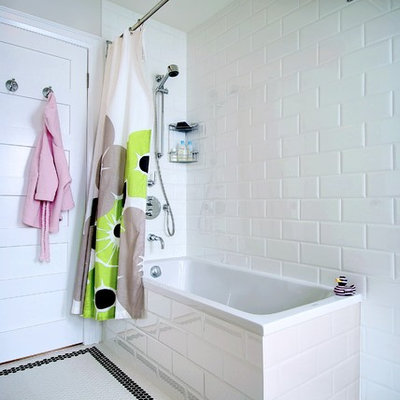 Inspiration for a mid-sized modern kids' white tile and subway tile mosaic tile floor and white floor bathroom remodel in Toronto with white walls, flat-panel cabinets, an undermount sink, solid surface countertops and white countertops