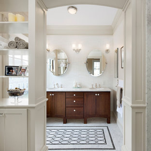 Inspiration for a victorian bathroom in Boston with an undermount sink, dark wood cabinets, white tile and shaker cabinets.