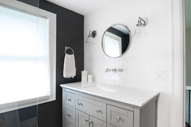 Bathroom - mid-sized craftsman master white tile and subway tile ceramic tile and white floor bathroom idea in Detroit with furniture-like cabinets, gray cabinets, a two-piece toilet, black walls, an undermount sink, marble countertops and white countertops