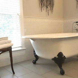Inspiration for a country ceramic tile porcelain tile claw-foot bathtub remodel in Chicago with gray walls