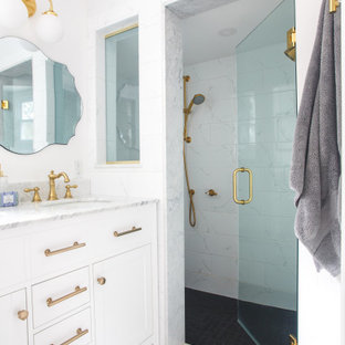 Bathroom - small transitional white tile and marble tile marble floor, multicolored floor and double-sink bathroom idea in Boston with shaker cabinets, white cabinets, a two-piece toilet, white walls, an undermount sink, marble countertops, a hinged shower door, white countertops and a built-in vanity