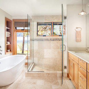 Freestanding bathtub - rustic master beige tile and multicolored tile beige floor freestanding bathtub idea in Other with shaker cabinets, light wood cabinets, beige walls, an undermount sink, a hinged shower door and beige countertops