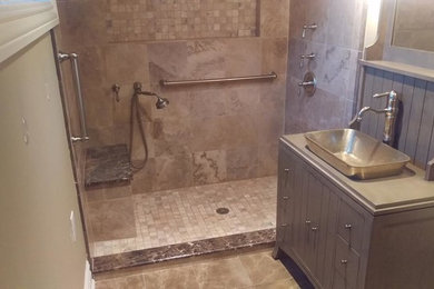 Example of a country ceramic tile alcove shower design in New York with flat-panel cabinets, gray cabinets, beige walls, a vessel sink and quartzite countertops