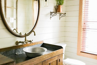 Bathroom - small cottage bathroom idea in Grand Rapids with a one-piece toilet and a vessel sink