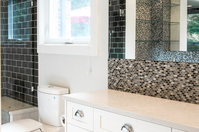 Example of a mid-sized transitional master gray tile and mosaic tile ceramic tile bathroom design in Vancouver with shaker cabinets, white cabinets, gray walls, an undermount sink and quartz countertops