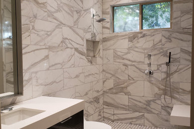 Shower bench - mid-sized modern white tile and marble tile porcelain tile, gray floor and single-sink shower bench idea in Las Vegas with flat-panel cabinets, dark wood cabinets, an undermount sink, quartzite countertops, white countertops and a built-in vanity