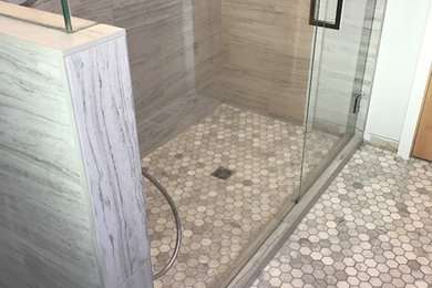 Alcove shower - large traditional 3/4 gray tile and porcelain tile marble floor alcove shower idea in Sacramento with a two-piece toilet, quartz countertops and white walls
