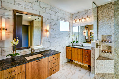 Imagen de cuarto de baño principal contemporáneo con lavabo bajoencimera, armarios con paneles lisos, puertas de armario de madera oscura, ducha abierta, baldosas y/o azulejos multicolor y ducha abierta