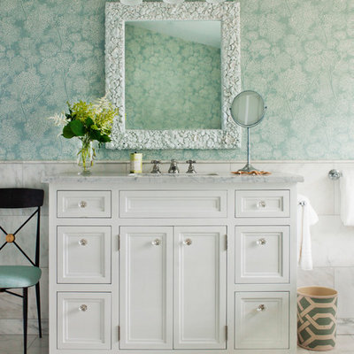 Example of a beach style white tile white floor bathroom design in New York with recessed-panel cabinets, white cabinets, green walls, an undermount sink and white countertops