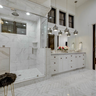 Inspiration for a country master gray tile, white tile and marble tile marble floor and gray floor bathroom remodel in Other with recessed-panel cabinets, white cabinets, white walls, an undermount sink, a hinged shower door and gray countertops