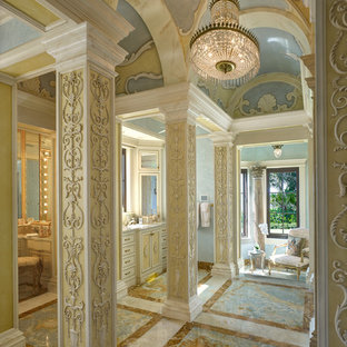 Bathroom - huge mediterranean master bathroom idea in Miami with recessed-panel cabinets, yellow cabinets and multicolored walls