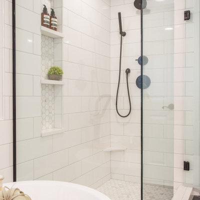 Bathroom - mid-sized country master white tile and subway tile porcelain tile and black floor bathroom idea in Seattle with shaker cabinets, light wood cabinets, a one-piece toilet, white walls, an undermount sink, a hinged shower door, white countertops and quartz countertops