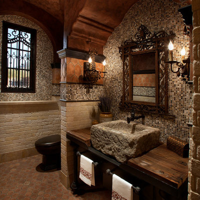 Bathroom - mediterranean mosaic tile bathroom idea in Phoenix with wood countertops, a vessel sink and brown countertops