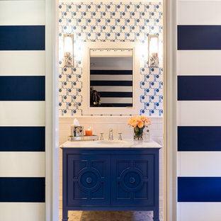 Mid-sized eclectic 3/4 bathroom in San Francisco with furniture-like cabinets, blue cabinets, white tile, ceramic tile, blue walls, marble floors, an undermount sink, marble benchtops and grey floor.