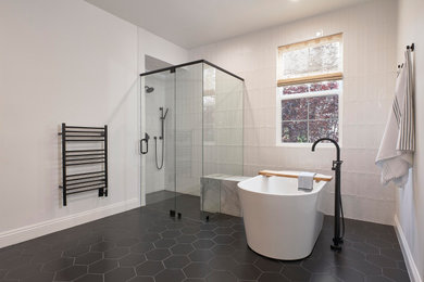 Inspiration for a large modern master white tile freestanding bathtub remodel in San Francisco with marble countertops