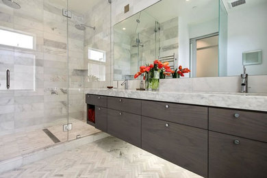 Mid-sized trendy master gray tile, white tile and marble tile marble floor and white floor alcove shower photo in San Francisco with an undermount sink, a hinged shower door, flat-panel cabinets, dark wood cabinets, white walls and marble countertops